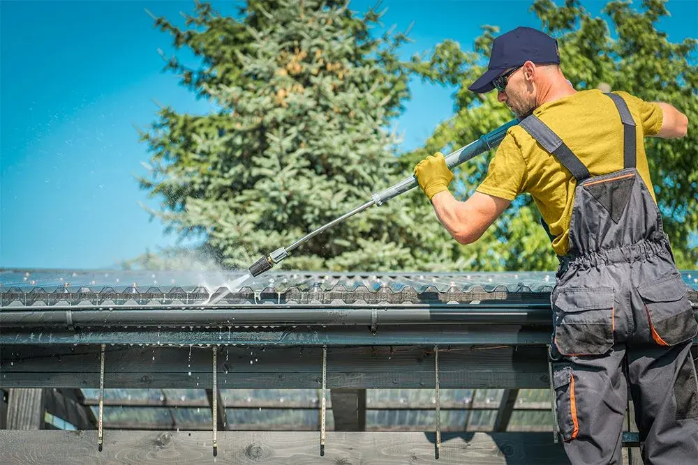Gutter being flushed with water after clearing